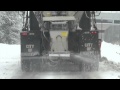 Salt trucks and plows clear snowy roads