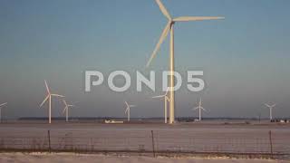 Wind Turbines Pan Across Field - Old-Timey Looking Footage Stock Footage Preview