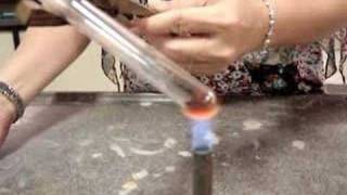 Heating of red lead(II) oxide