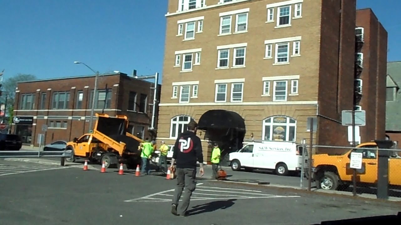 pittsfield ma dpw working on a pot hole the first street burgerking