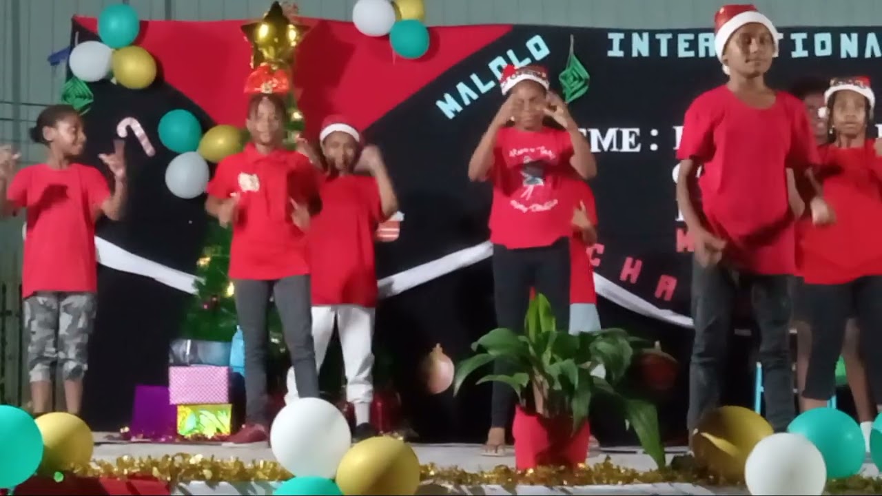 Grade 5 students performing at the Carol's by candle light @Malolo International school 2023