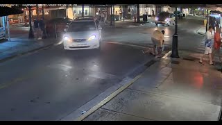 person falls while crossing street outside sloppy joes