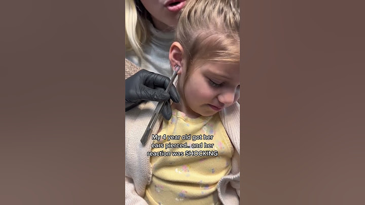 SHOCKING reaction to getting her ears pierced.. #shorts