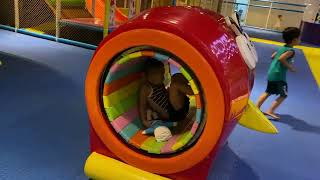 Kids  at indoor playground play center with toys