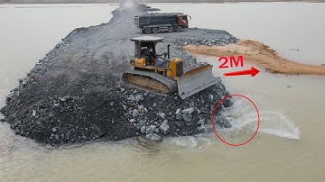 Excellent Techniques Operator Skill Bulldozer Spreading Stone into Water Building New Road on Lake