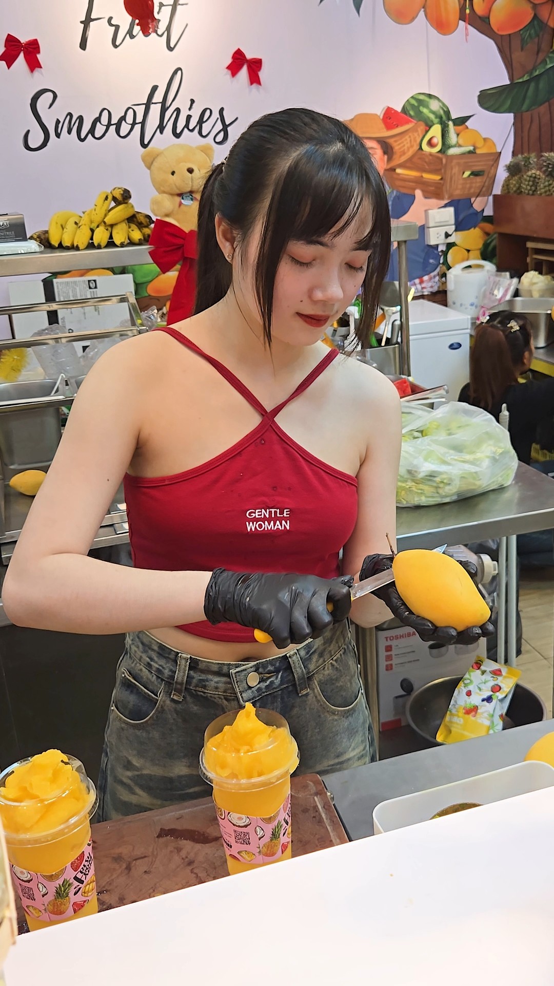 Thai Girl Selling Mango Smoothie at Jodd Fairs Night Market