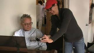 Mark Mothersbaugh plays for the cast & crew during lunch at the Devo video shoot