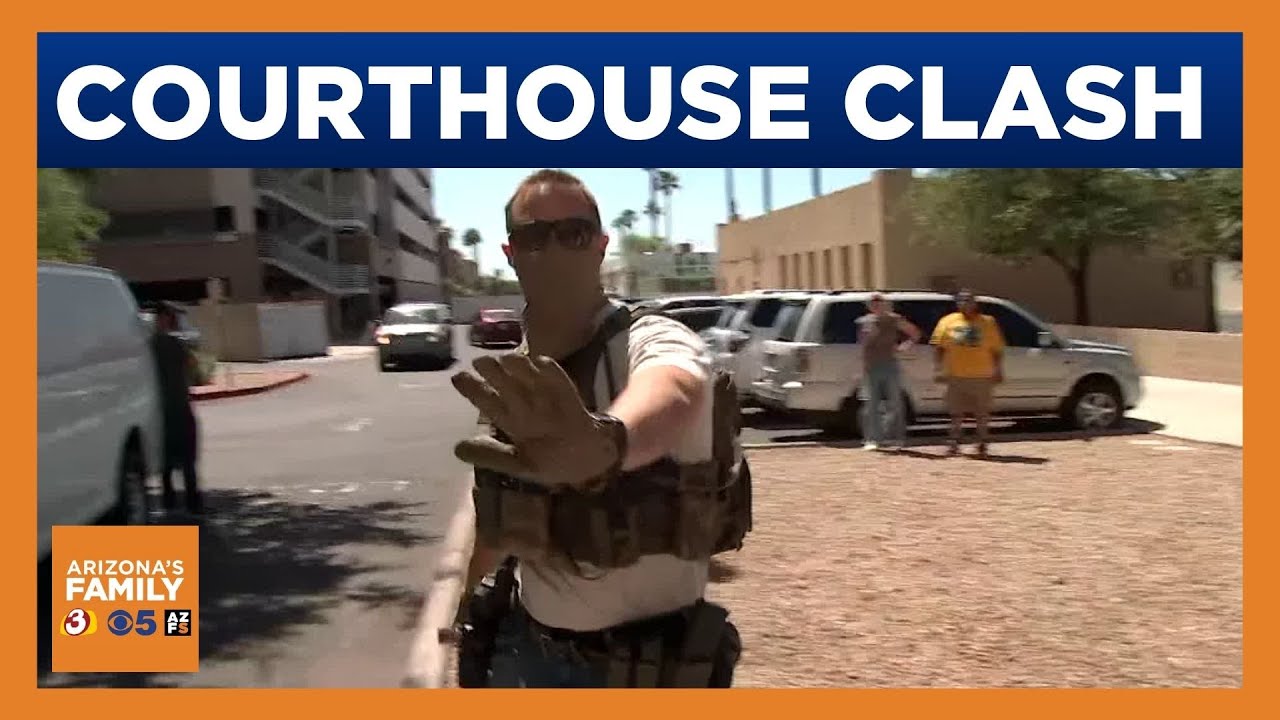 Tense moments as protestors, agents clash outside Phoenix courthouse