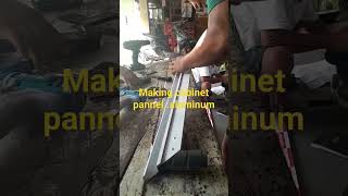 Making aluminum frame for cabinet.