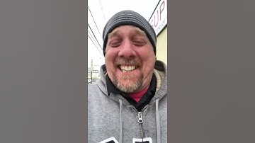 Man Giggles at Woman