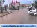 تواضع الملك تحت أمطار وجدة