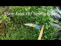 Trimming the garden paths with a 35cm scythe blade