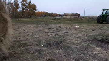 How to unload round bales with no loader