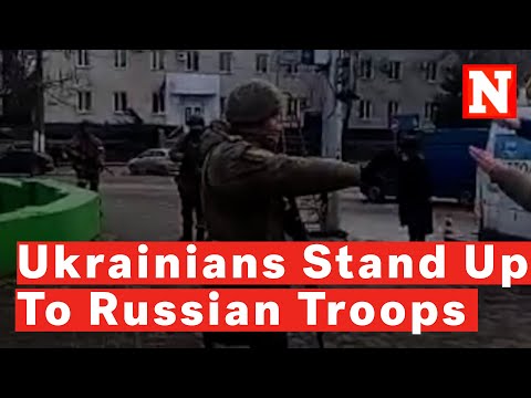 Dramatic Video Shows Ukrainian Citizens Stand Up To Russian Soldiers As They Fire Guns