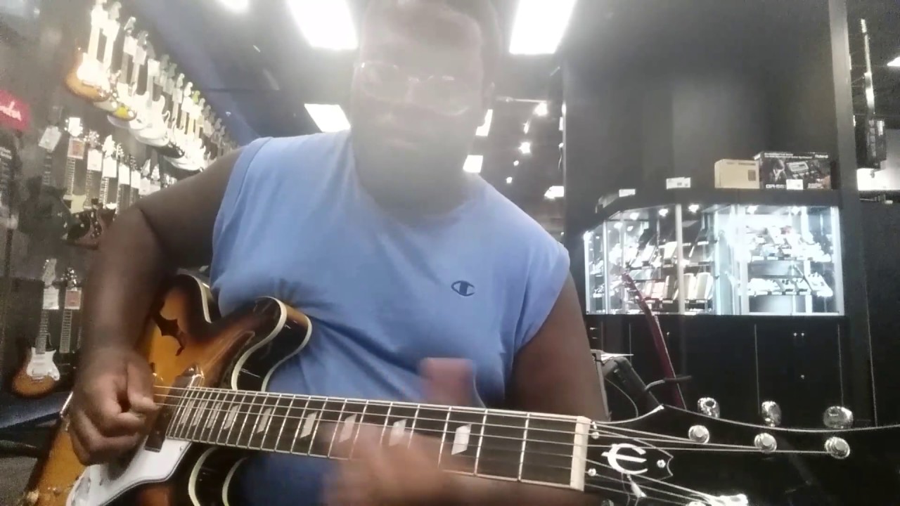 Playing an Epiphone Casino at the Guitar Center in Pasadena, California