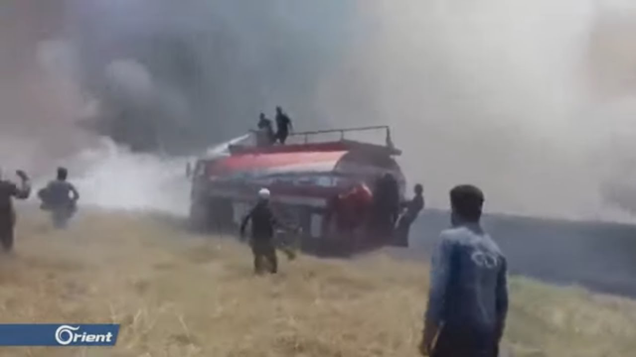 شرق الفرات امريكا عناصر ميليشيا قسد يرقصون على وقع احتراق أراضي الفلاحين في الحسكة - سوريا
