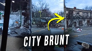 Person in a Car Showcasing the Status of a City After Troops Left