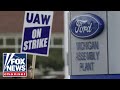 &#39;AS LONG AS IT TAKES&#39;: UAW workers hold out as strike reaches third day