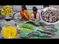 How snake head fish cutting  cooking with tasty taro root by santali tribe girl  rural lifestyle