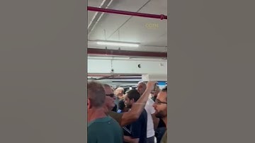 Thumbnail of Israelis sing national anthem in a bunker