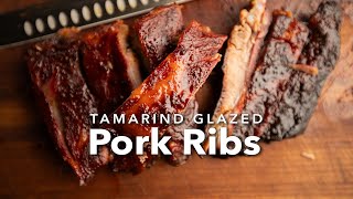 How to Make Tamarind Glazed Pork Ribs | Sticky, Sweet, & Smoky!
Tamarind Glazed Pork Ribs Recipe | Sweet & Tangy BBQ Ribs with Chef Tom
These sticky, sweet, and tangy tamarind glazed pork ribs are everything you want from a rib cook—and they’re easier to make than you think on the Yoder Smokers YS640s pellet grill. Tamarind paste, a bold and tangy ingredient made from the pulp of the tamarind fruit, pulls double duty in this recipe—first as a binder to hold on a generous layer of Plowboys Yardbird Rub, and then mixed with pineapple juice to create a flavorful wrap that infuses the ribs with tropical depth. Finish them off with a brush of honey glaze, and you’ve got ribs that are fall-off-the-bone tender and packed with mouthwatering flavor. Fire up your grill—these are ribs worth showing off.
► Find the full recipe here on ATBBQ: https://www.atbbq.com/blogs/recipes/tamarind-glazed-pork-ribs
► Find the Yoder Smokers YS640s at ATBBQ: https://www.atbbq.com/products/yoder-smokers-ys640s-pellet-grill-with-acs
► WATCH OUR FAVORITES NOW!: https://www.youtube.com/playlist?list=FLSeKtP7bqePrJqi99UX2NSQ
** FOLLOW US **
FACEBOOK: https://www.facebook.com/allthingsbbq
TWITTER: @atbbq
INSTAGRAM: @atbbq @cheftomjackson
TIKTOK: @allthingsbbq
00:00 Introduction
00:23 Trim the Ribs
01:38 Apply the Binder & Seasoning
02:46 Place the Ribs on the Smoker
03:15 Wrap the Ribs
04:02 Checking Doneness
04:24 Glaze the Ribs
04:39 Slice the Ribs
04:54 Get a Bite!
05:20 Like & Subscribe! How to Make Tamarind Glazed Pork Ribs | Sticky, Sweet, & Smoky!