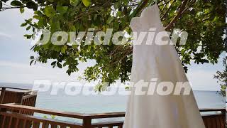 Elegant Lace Dress Of The Bride Hanging On A Tree On The Hotel Terrace Overlooking The Ocean