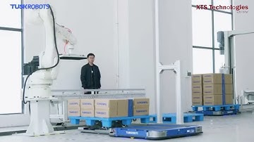 Pallet AGV  or AGF Tusk robotics pallet robot handling automation with conveyor and lift warehouse