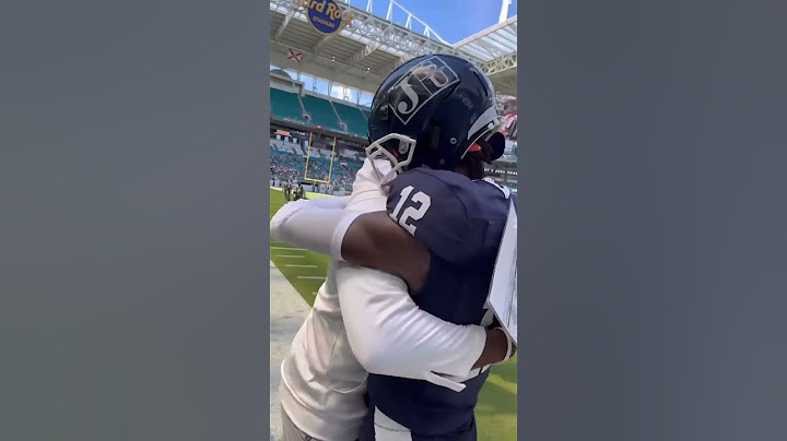 Travis Hunter cries on Coach Prime’s shoulder before first game of his college career