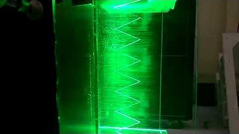 3D PTV with synchronized hydrodynamic surface pressure measurement using pinhole mounted microphones