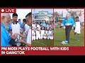 Narendra Modi plays football with children in Gangtok, Sikkim