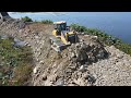 Amazing road building mighty machines bulldozer pushing rock and soiltruck unloading rock and soil