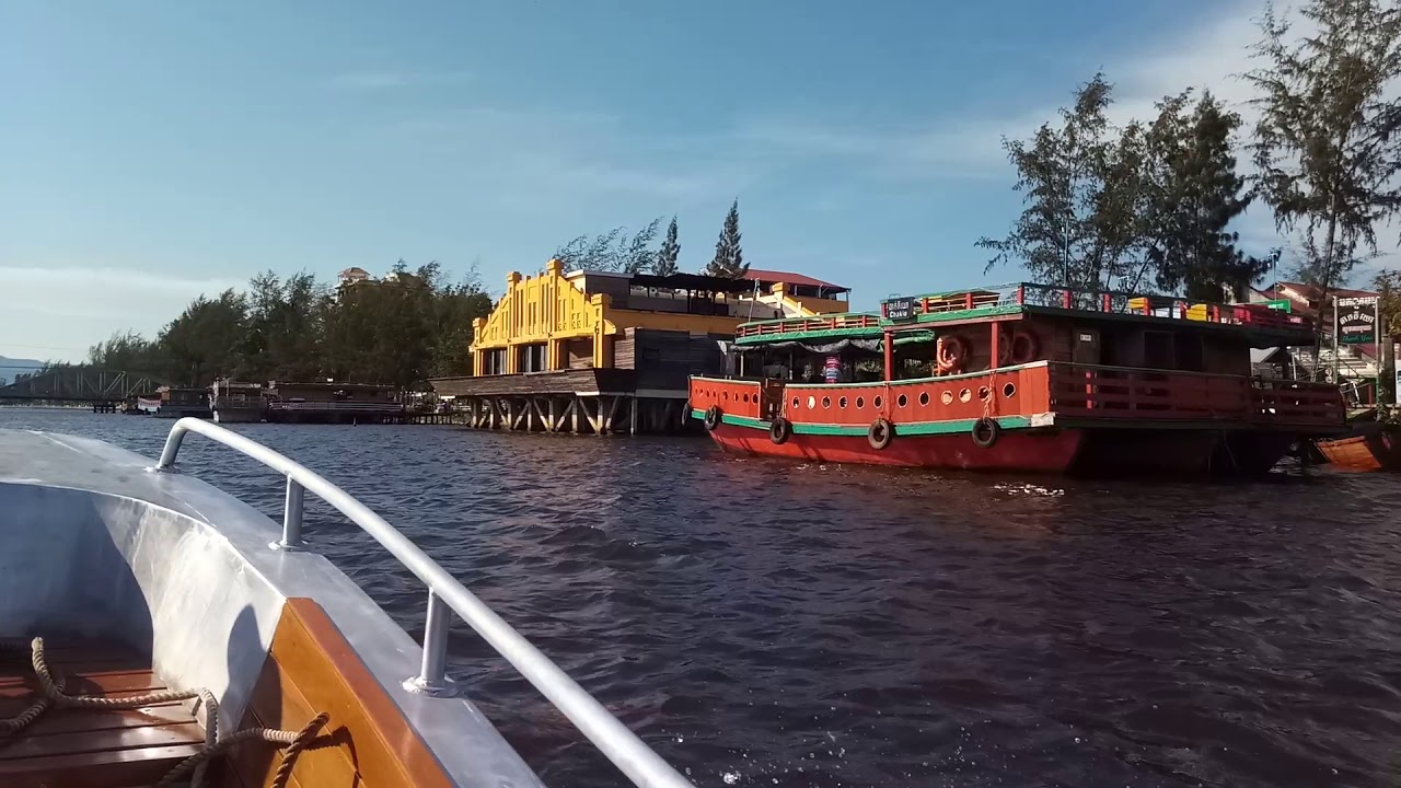 Sled Boat cruising the river at Kampot, Cambodia