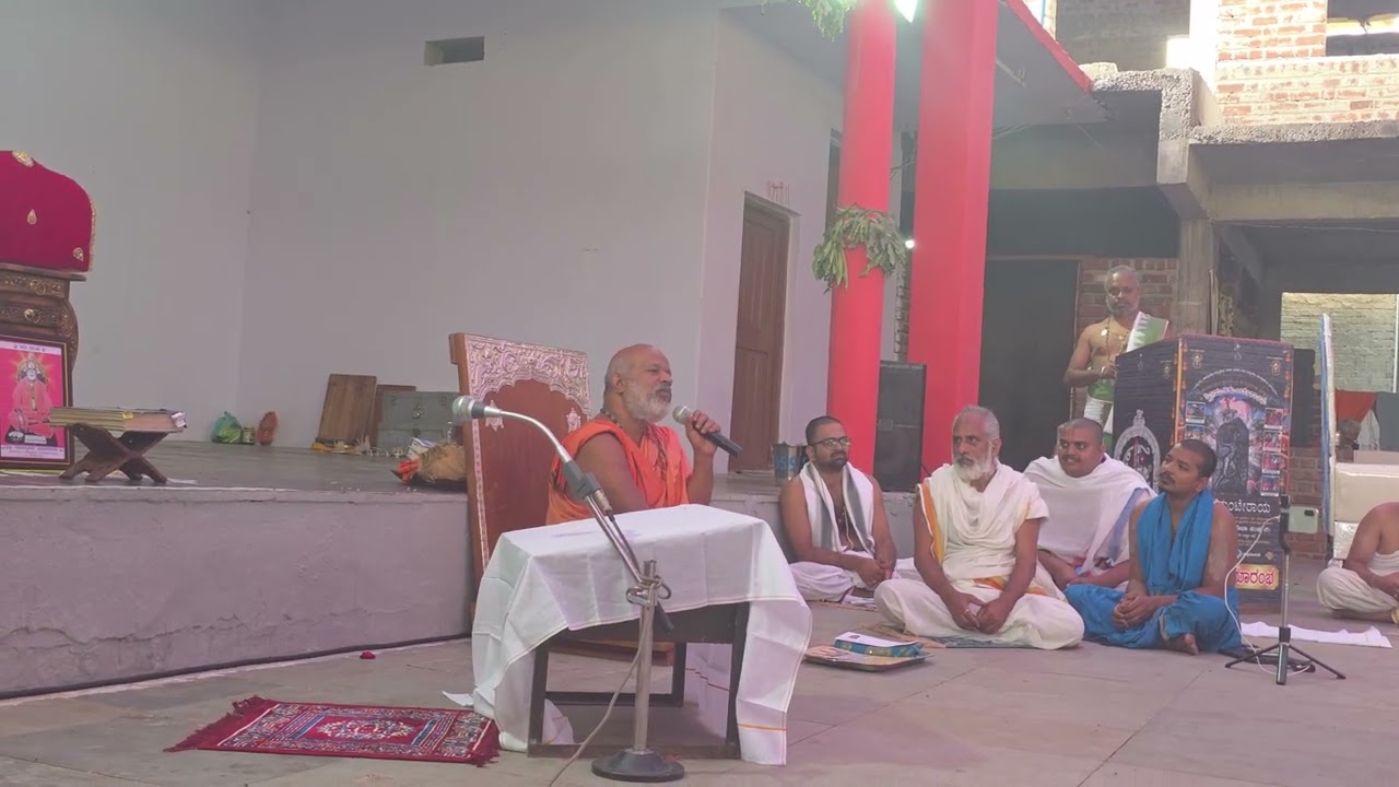 Sri Akshobhya Ramapriya Teertha Swamiji blesses Pavan M Srivatsa after his speech on psychology