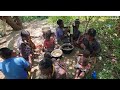 Premitive life of the hadzabe family in the wildernesscooking and eating their traditional lunch