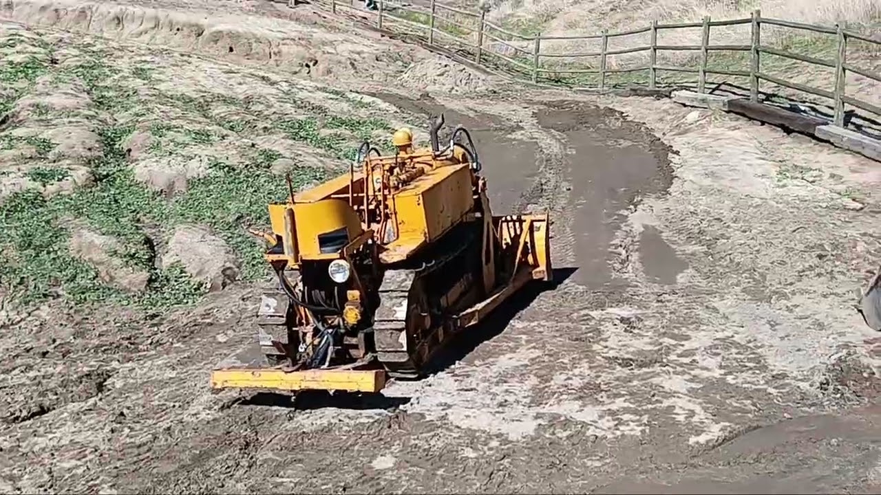 CLARK AIRBORNE DOZER PLOWING ON STEEP HILL