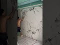 Installation of large ceramic tiles on patterned room divider walls #shorts