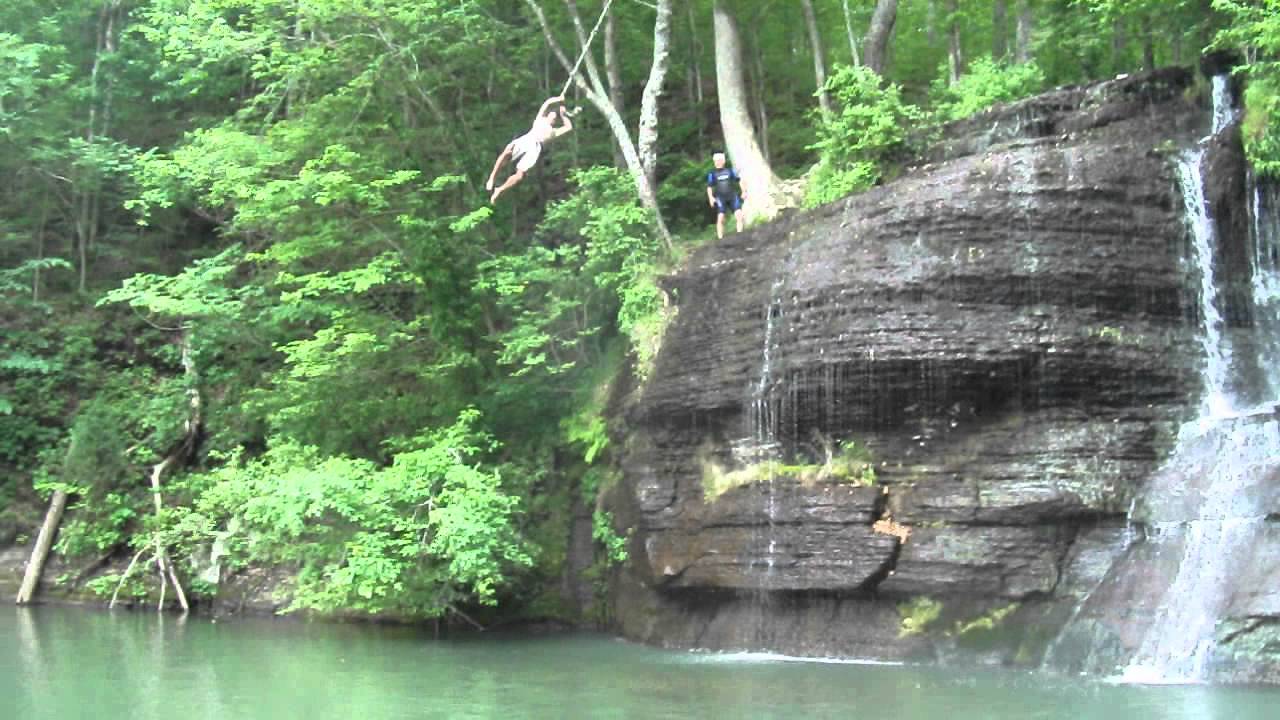 Steven jumping from the rope swing over the falls at Cooper Hollow