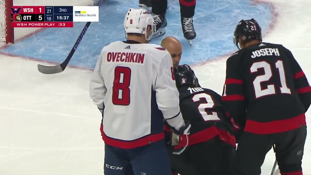 Artem Zub hit in ear with puck