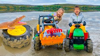 Darius and Francesca saved the tractor wheel from the mud and fed with candies the crocodile