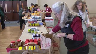 Volunteers prep meal kits to help homeless teens