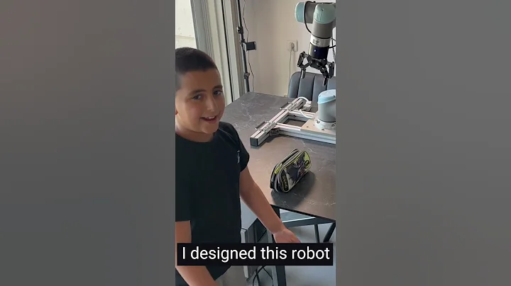 An 8-year-old boy programs an industrial Collaborative robot. UR5 Universal Robots