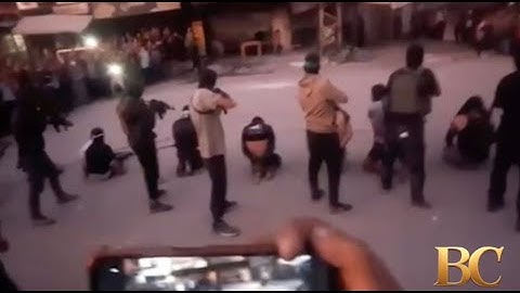 Masked Hamas fighters seen executing men in Gaza City as the group fights with rival powers