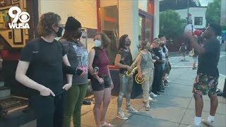 Human chain formed outside Nellies Sports Bar after it reopens following controversial video
