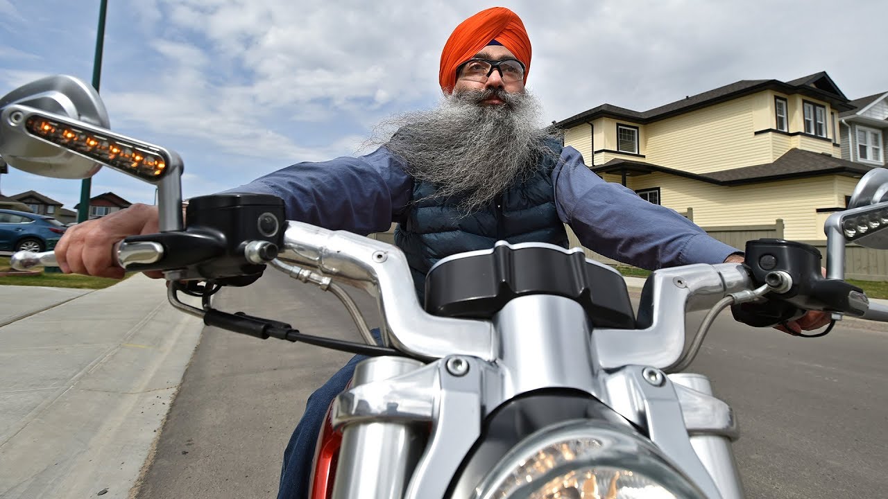 Sikh motorcyclist cruises the blacktop helmetless via new licence - YouTube