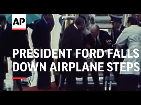 President Ford falls down airplane steps 