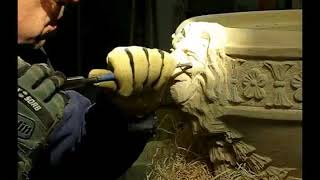 Carving a lions head in limestone