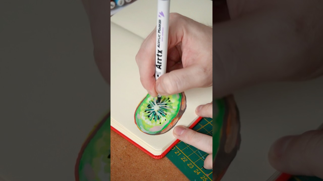 Kiwi slice in my sketchbook with acrylic markers 