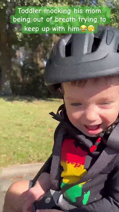 Toddler on bike mocking mom for being out of breath while trying to keep up with him for the video