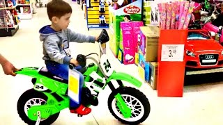 Little Boy Playing at Toys R Us Superstore Fun For Kids