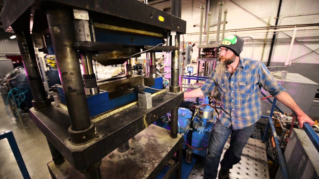 Compression molding presses and curing ovens at Kitsap Composites, Inc.